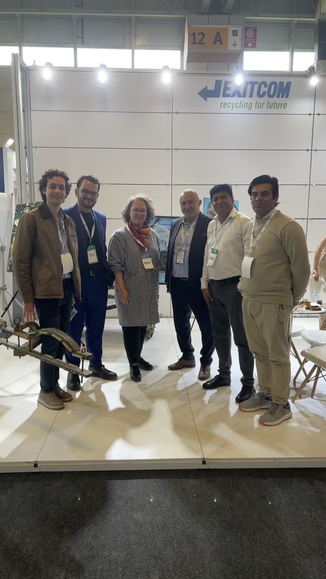 Group photo with Hamid Rehman, Hassan Mahdi and Uğurcan Sulubulut at the Exitcom booth, IFAT Eurasia 2025
