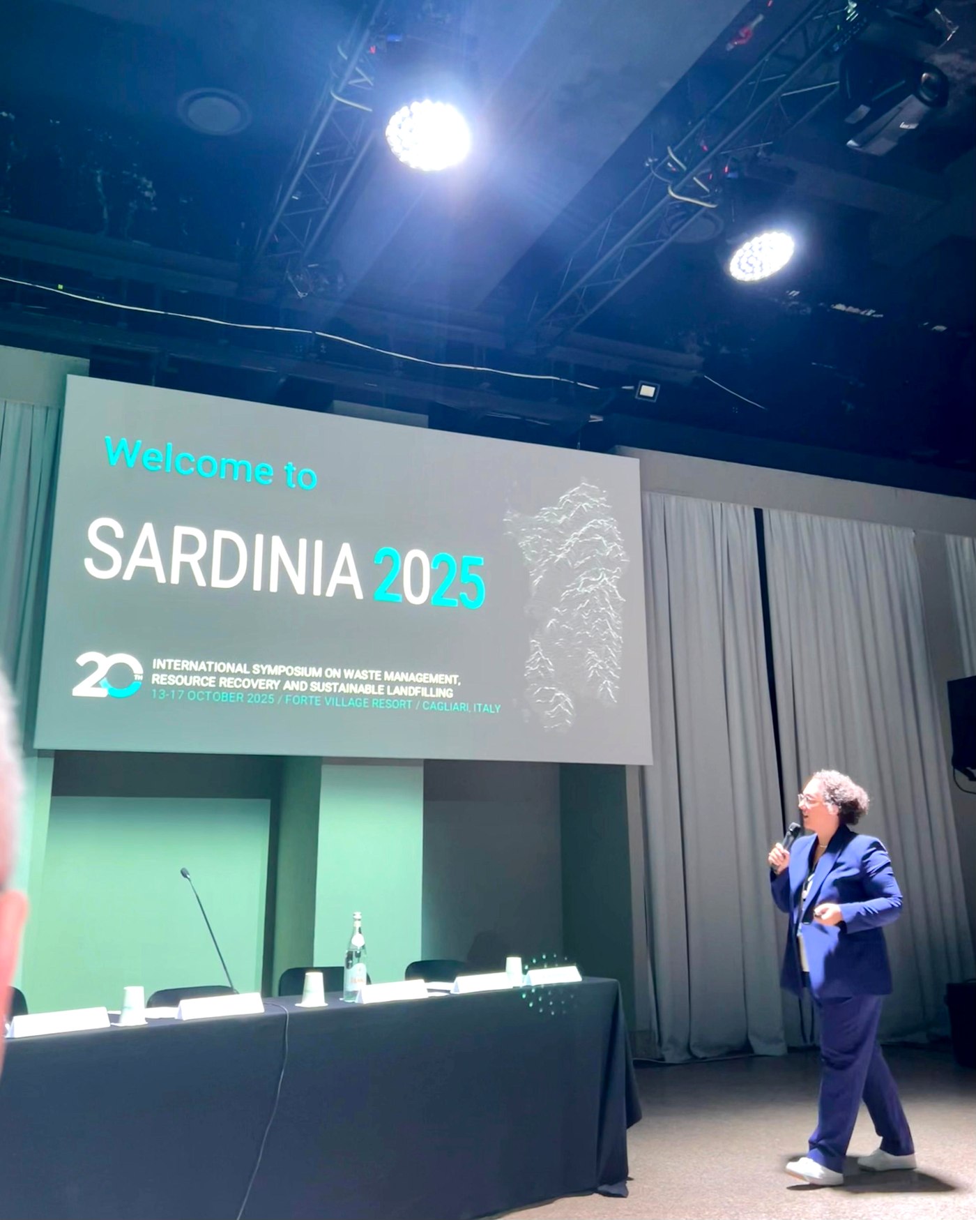 Kubra Ulucan-Altuntas presenting on stage at Sardinia 2025